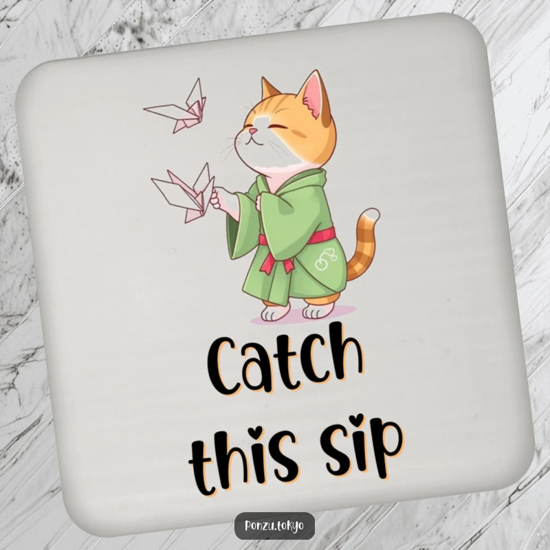Funny cat in a green kimono playfully attempting to catch a floating origami crane, a fun drink coaster.