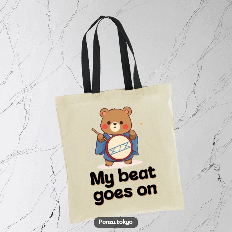 Funny cute bear in a blue kimono energetically playing a taiko drum on a tote bag.